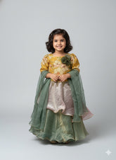Yellow top and green lehenga with flower detailing